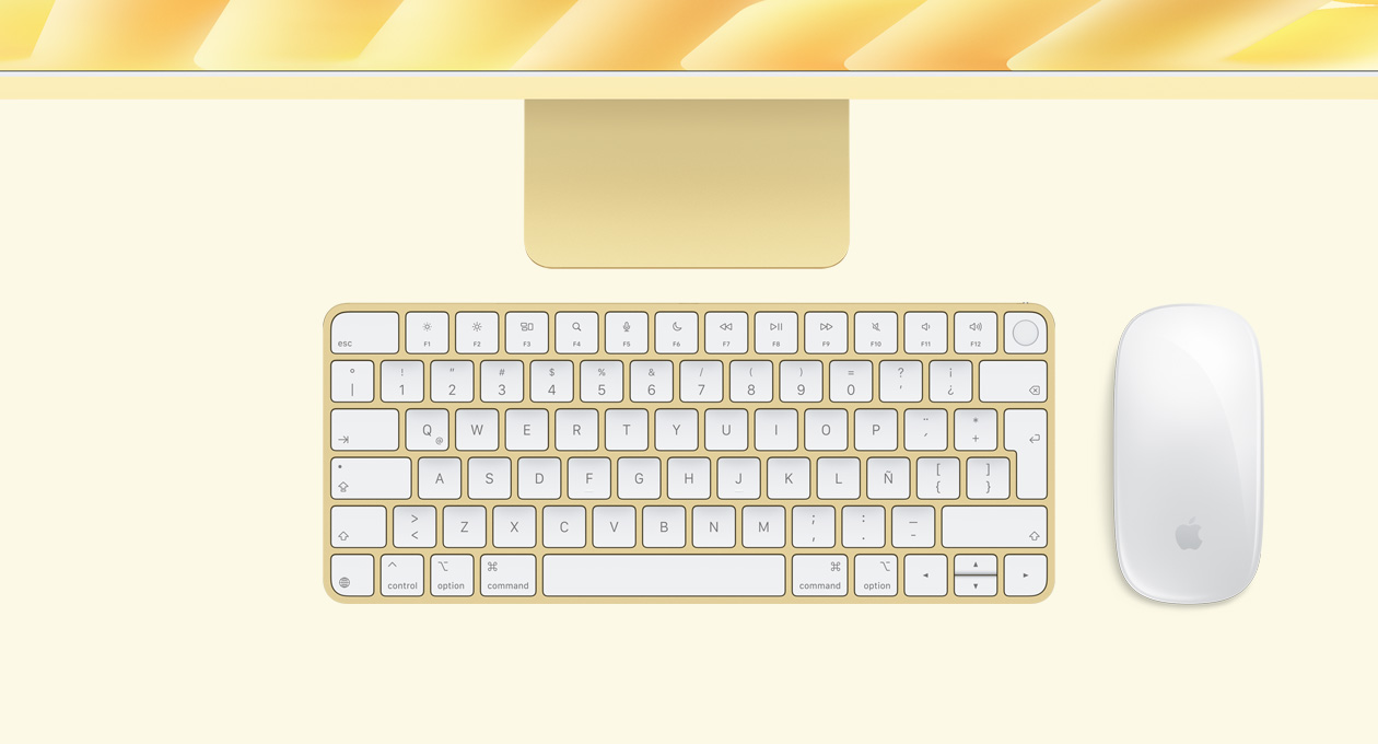 iMac, color amarillo, parte superior, con Magic Mouse y Magic Keyboard con Touch ID