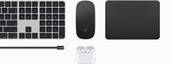 Collection of accessories including Magic Keyboard with Touch ID, Magic Mouse, Magic Trackpad, Thunderbolt 5 Pro cable, and AirPods Pro