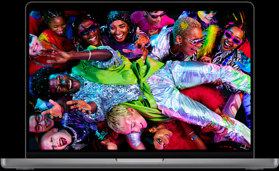 MacBook Pro, silver color, open, display shows image of person dressed in silver, crowd surfing