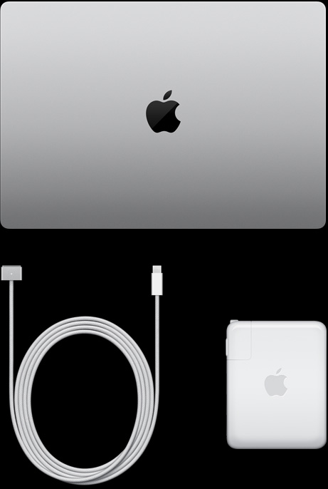 MacBook Pro, silver color, top, closed, next to charging cable and adapter